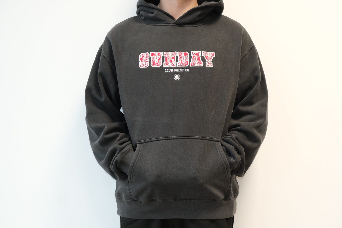Sunday Club Embroidered Varsity Hoodie in Faded Black.